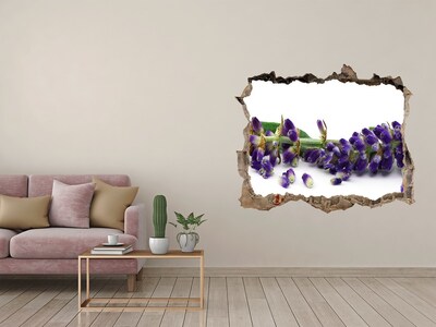 Wandsticker 3D gat met uitzicht Een lavendelbloem door een gat in de muur.