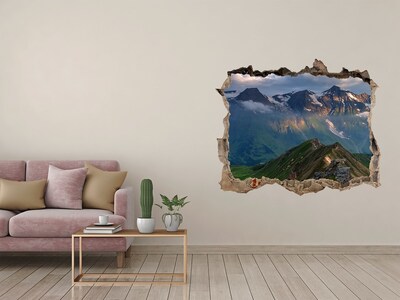 Wandsticker 3D gat met uitzicht Berglandschap achter het gat in de muur