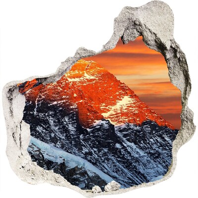3D wandsticker gat in de muur Bergen in de ondergaande zon