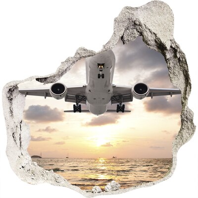 3D muursticker effect gat in de muur Vlucht de ondergaande zon tegemoet