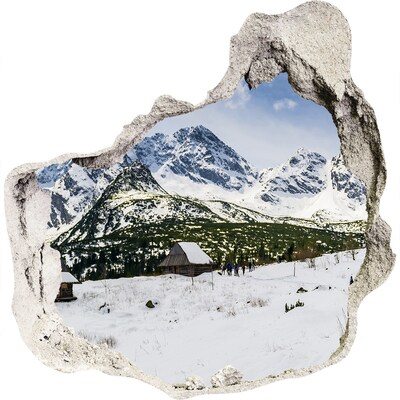 3D muursticker effect gat in de muur Winters berglandschap