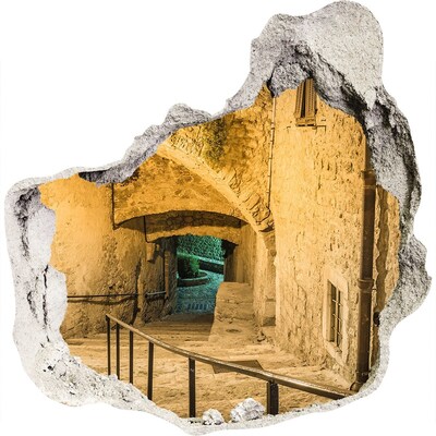 3D muursticker effect gat in de muur Een historische straat in de oude binnenstad.