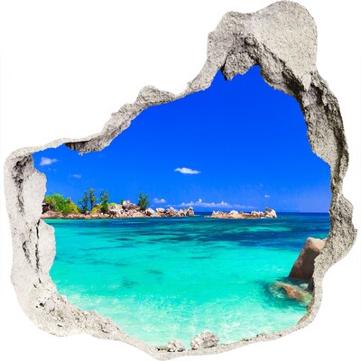 Zelfklevende muursticker 3D gat Caribisch strand door een gat in de muur