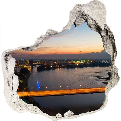 3D wandsticker gat in de muur Uitzicht op de stad bij zonsondergang