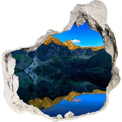 3D muursticker effect gat in de muur Berglandschap met een meer