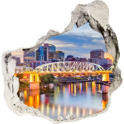 3D wandsticker gat in de muur Een brug over een rivier in de stad