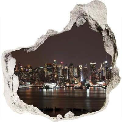 3D muursticker effect gat in de muur De skyline van New York 's nachts