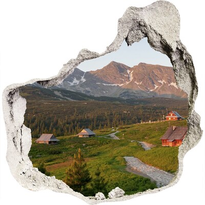 3D muursticker effect gat in de muur Bergdal met hutten