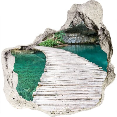 3D muursticker effect gat in de muur Mysterieuze brug over turkooizen water