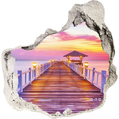 3D muursticker effect gat in de muur Zonsondergang boven de pier