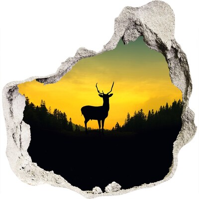 3D muursticker effect gat in de muur Herten tegen de achtergrond van de ondergaande zon.
