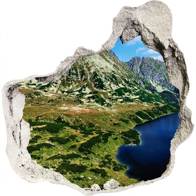 3D wandsticker gat in de muur Berglandschap met een meer