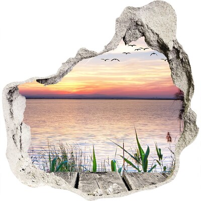 3D wandsticker gat in de muur Zonsondergang boven het meer