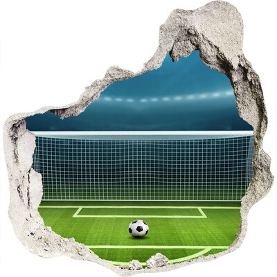Zelfklevende muursticker 3D gat Het voetbalstadion achter het gat in de muur.