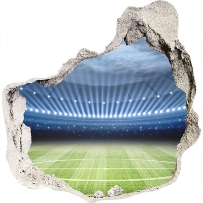 3D muursticker effect gat in de muur Het voetbalstadion in actie.
