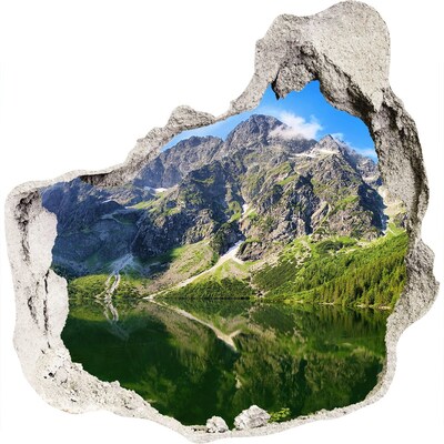 3D muursticker effect gat in de muur Berglandschap met een meer