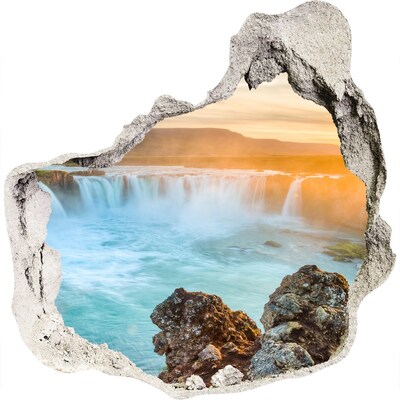 3D wandsticker gat in de muur Waterval in de ondergaande zon