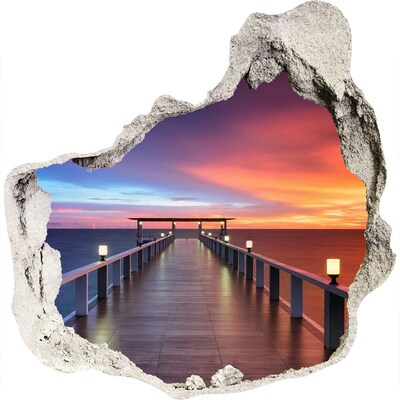 Zelfklevende muursticker 3D gat Zonsondergang boven de pier
