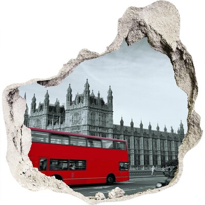 3D muursticker effect gat in de muur Londens stadsgezicht met een rode bus