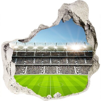 3D muursticker effect gat in de muur Het voetbalstadion in actie.