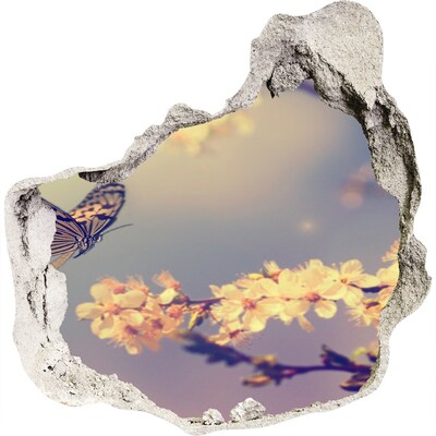 3D muursticker effect gat in de muur Bloemenlandschap met een vlinder