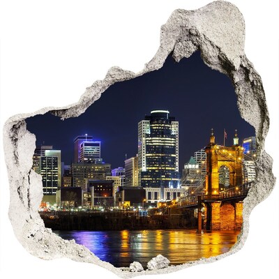 3D muursticker effect gat in de muur Nachtpanorama van de stad