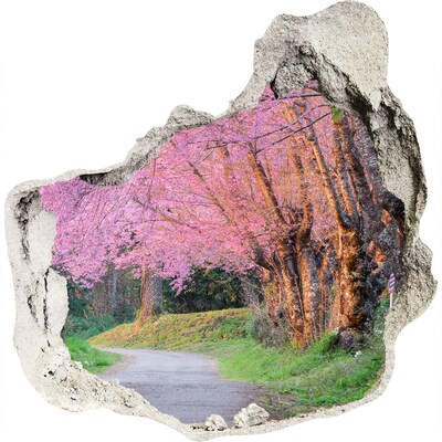 3D muursticker effect gat in de muur Een lentewandeling tussen de bloeiende bomen.