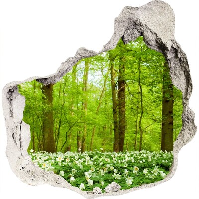 3D muursticker effect gat in de muur Een groen bos vol bloeiende bloemen