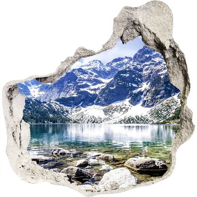 3D muursticker effect gat in de muur Berglandschap met een meer