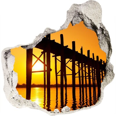 3D muursticker effect gat in de muur Zonsondergang boven de pier