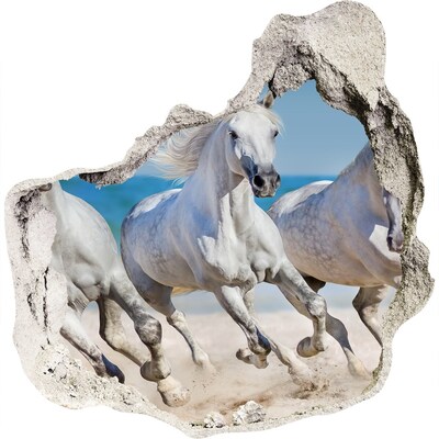 3D muursticker effect gat in de muur Witte paarden op het strand