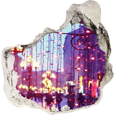 3D wandsticker gat in de muur Kerstverlichting in de stad