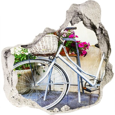 3D muursticker effect gat in de muur Een fiets in een bloemrijke omgeving.