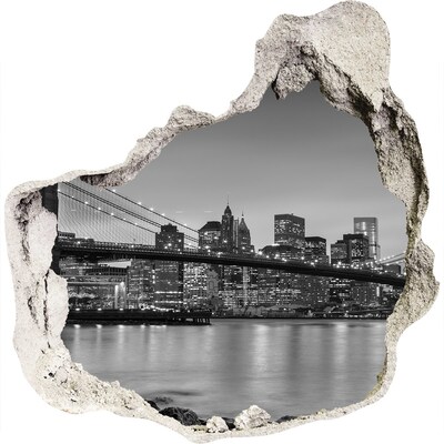 3D muursticker effect gat in de muur Een zwart-witbeeld van de stad.