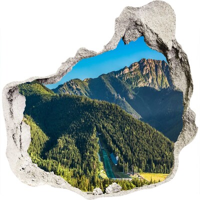 3D wandsticker gat in de muur Berglandschap met een vallei