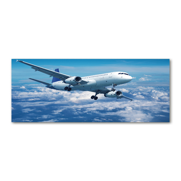 Foto in plexiglas Een vliegtuig in de wolken