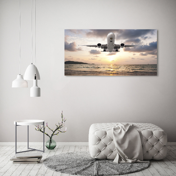 Schilderij op canvas Een vliegtuig boven de zee