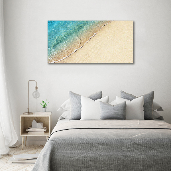 Foto canvas Een golf op het strand