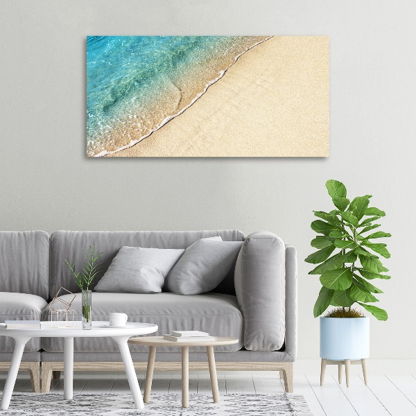 Foto canvas Een golf op het strand
