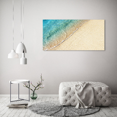 Foto canvas Een golf op het strand