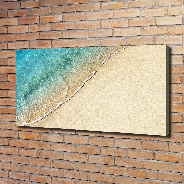 Foto canvas Een golf op het strand