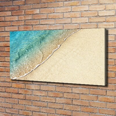 Foto canvas Een golf op het strand