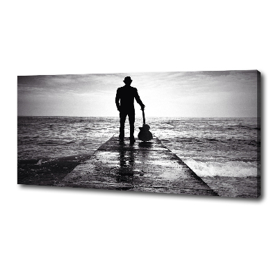 Canvas foto Gitarist op de pier