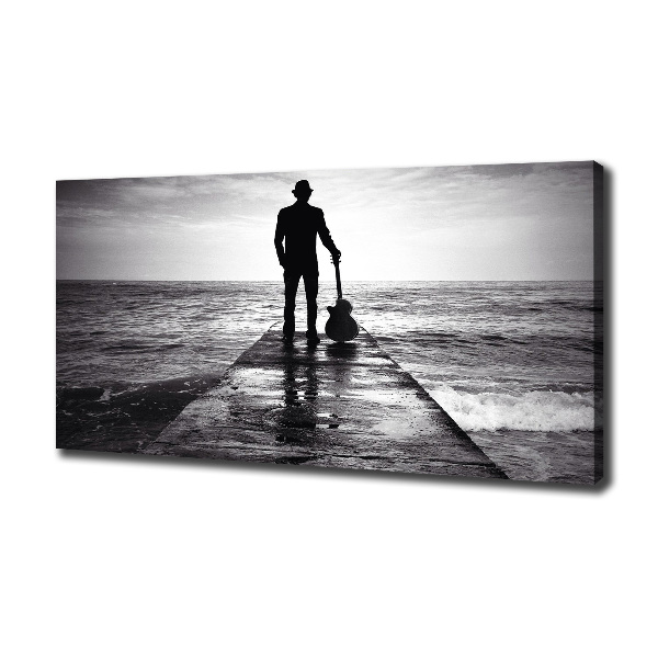 Canvas foto Gitarist op de pier