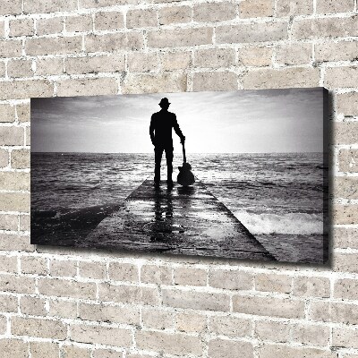 Canvas foto Gitarist op de pier
