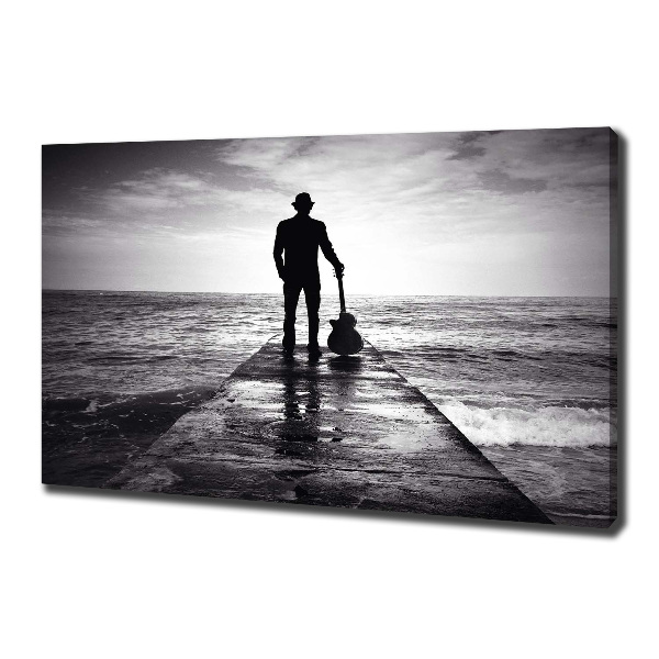 Canvas foto Gitarist op de pier