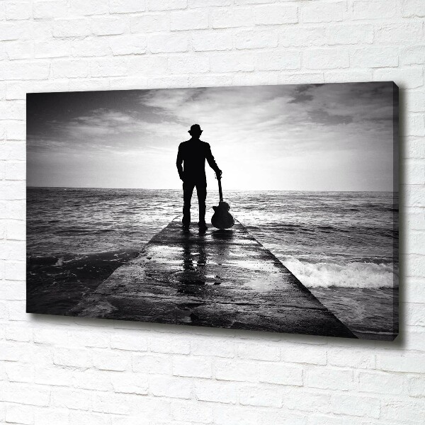 Canvas foto Gitarist op de pier