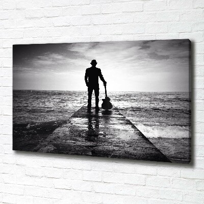 Canvas foto Gitarist op de pier