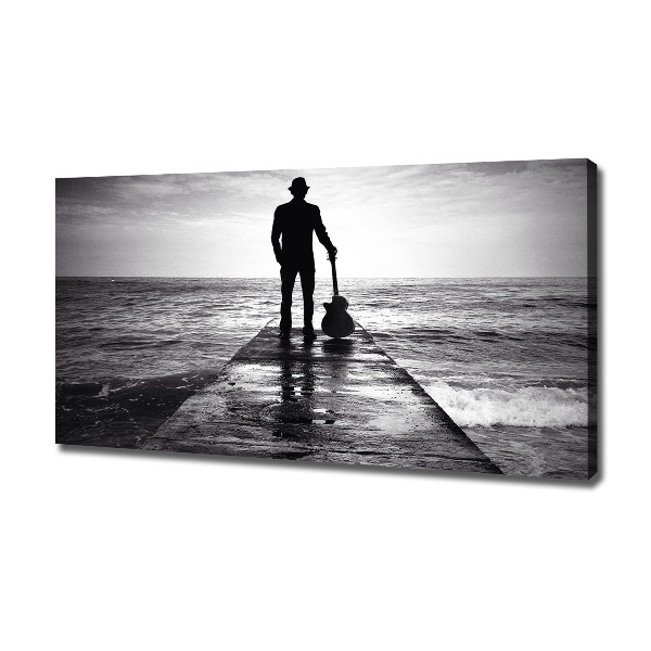 Canvas foto Gitarist op de pier