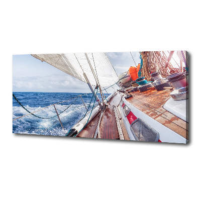 Canvas foto Een zeilboot op zee